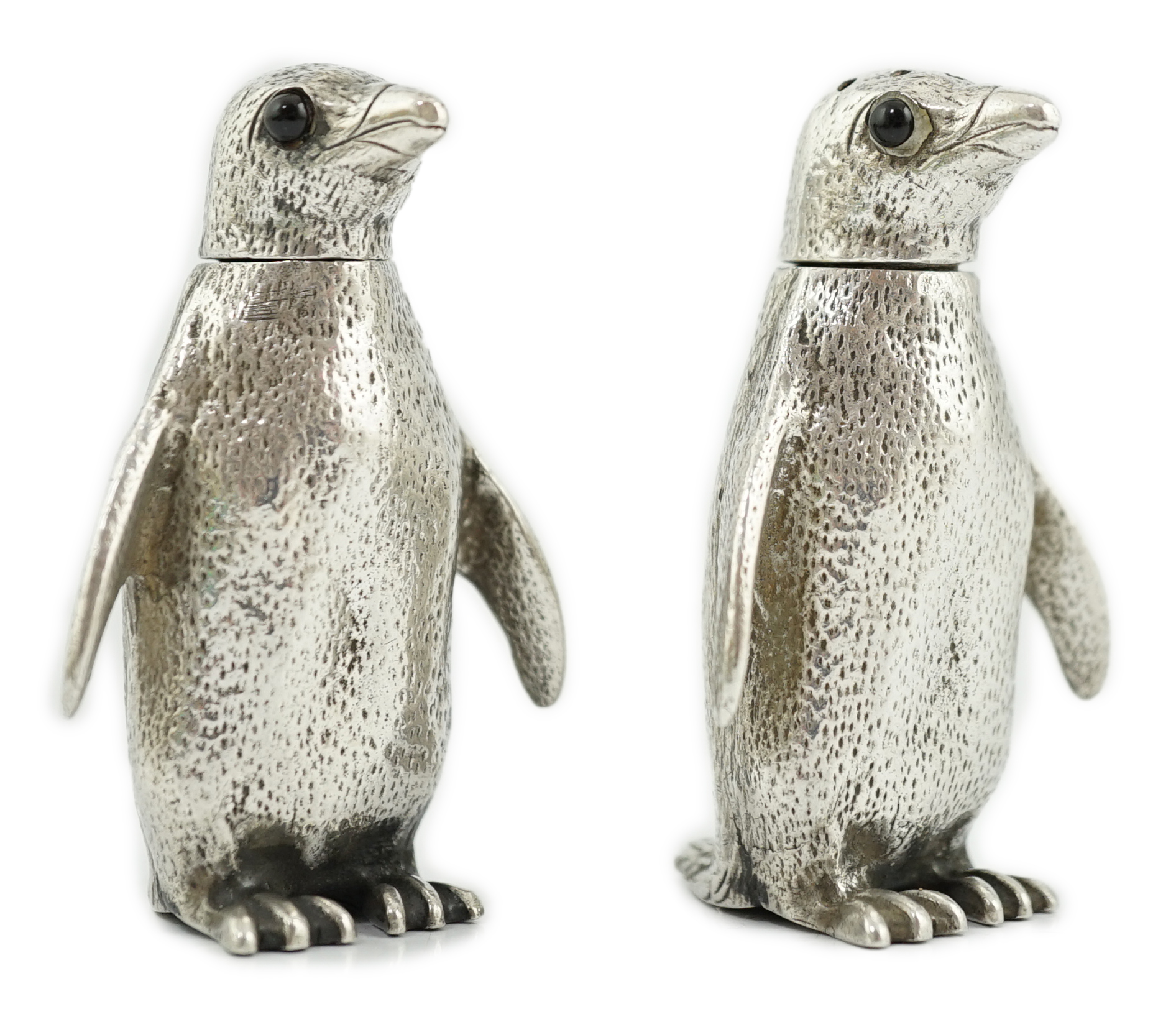 A pair of Elizabeth II silver novelty condiments, modelled as penguins, William Comyns & Sons Ltd